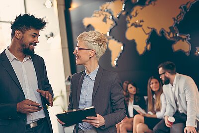 Young international employees discussing their work