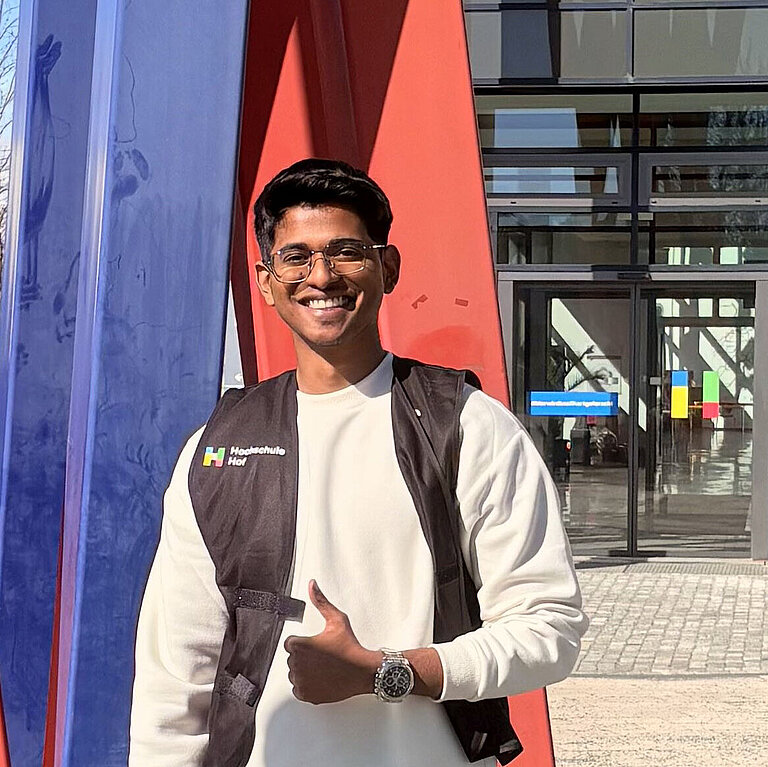 Aditya in front of main entrance